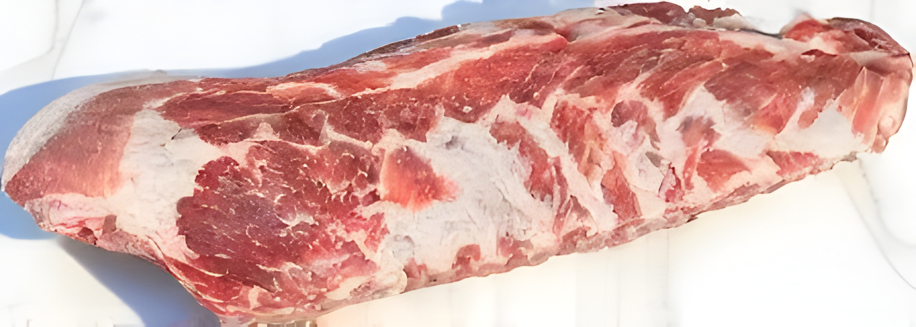 21-day dry-aged Pork Ribs on white marble